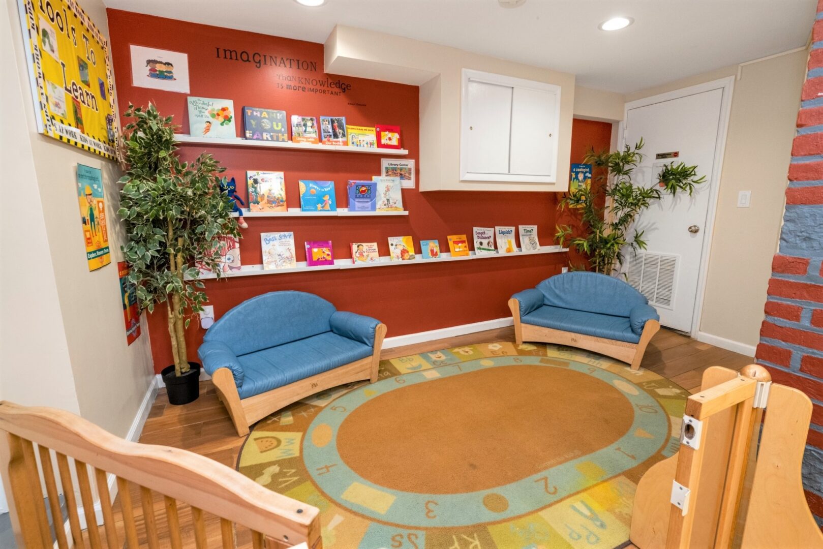Private library at Smart Start Academy with picture book shelves and soft seating