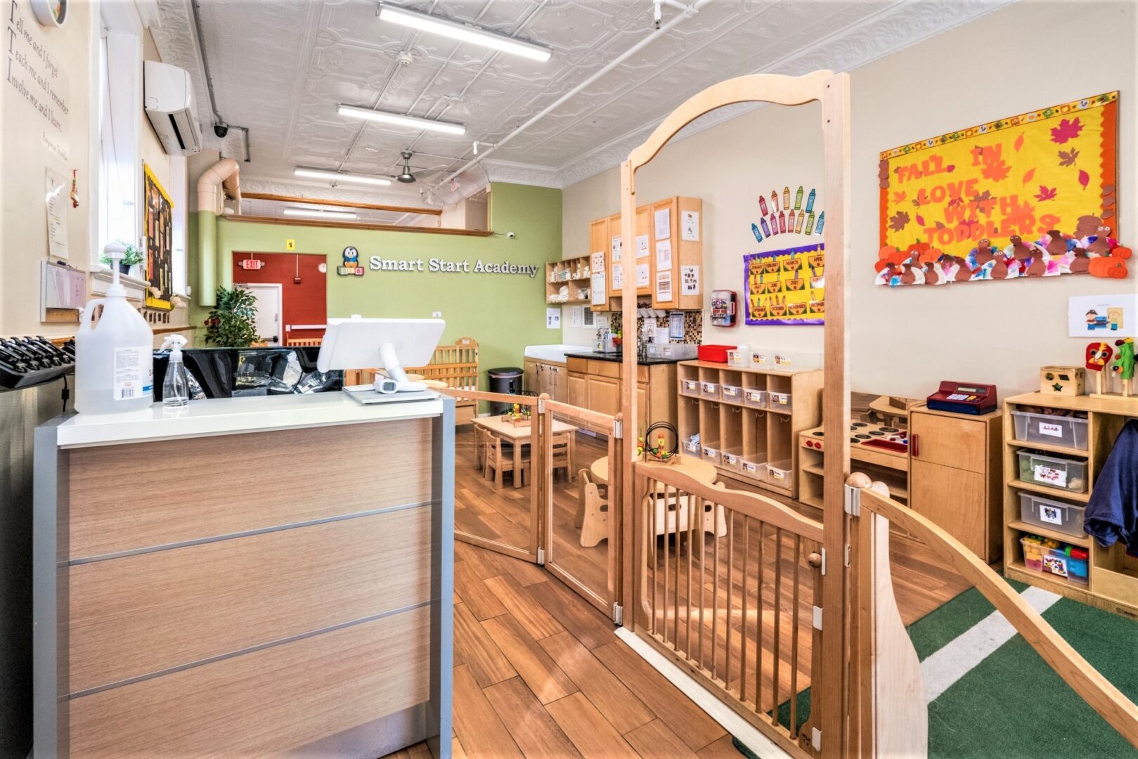 Reception desk and secured gate at the Smart Start Academy toddler lobby