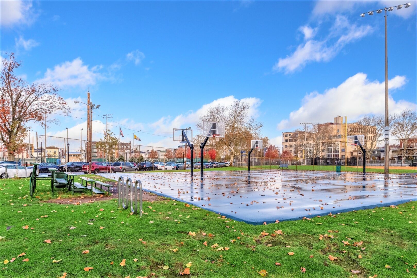 Neighborhood park basketball courts and open green space near Smart Start Academy