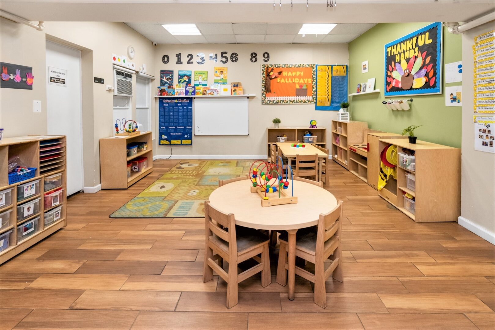 Preschool classroom at Smart Start Academy with number line and seasonal craft display