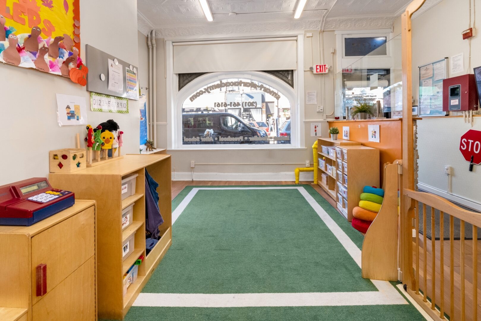 Bright arched window in the Smart Start Academy toddler classroom play area